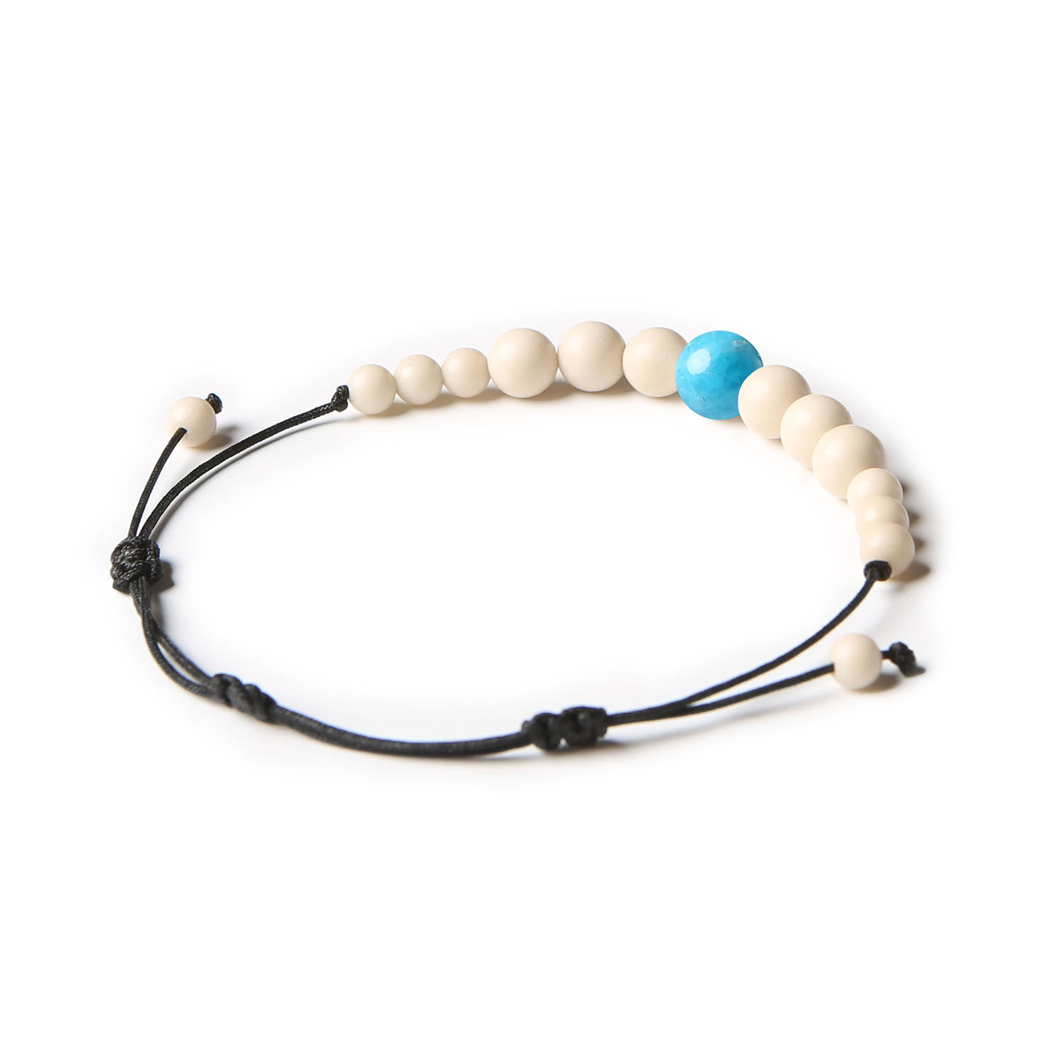 Bransoletka z kolekcji Jaue, z naturalnymi kamieniami apatytu i kamienia rzecznego, przeznaczona dla obu płci.