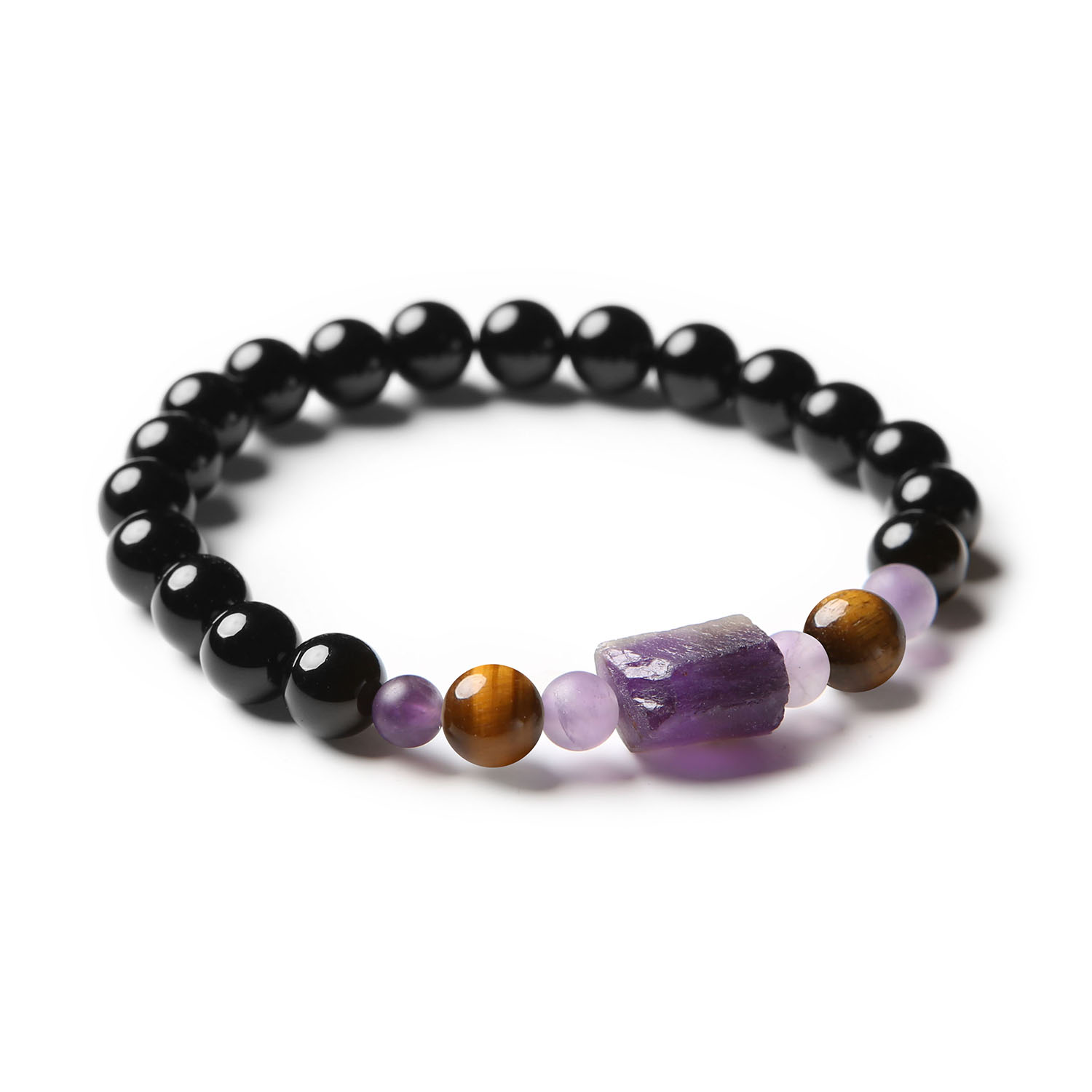 Bransoletka z kolekcji Kema wykonana z Tygrysiego Oka, Ametystu i Onyksu, dostępna w wersjach zarówno damskich, jak i męskich.