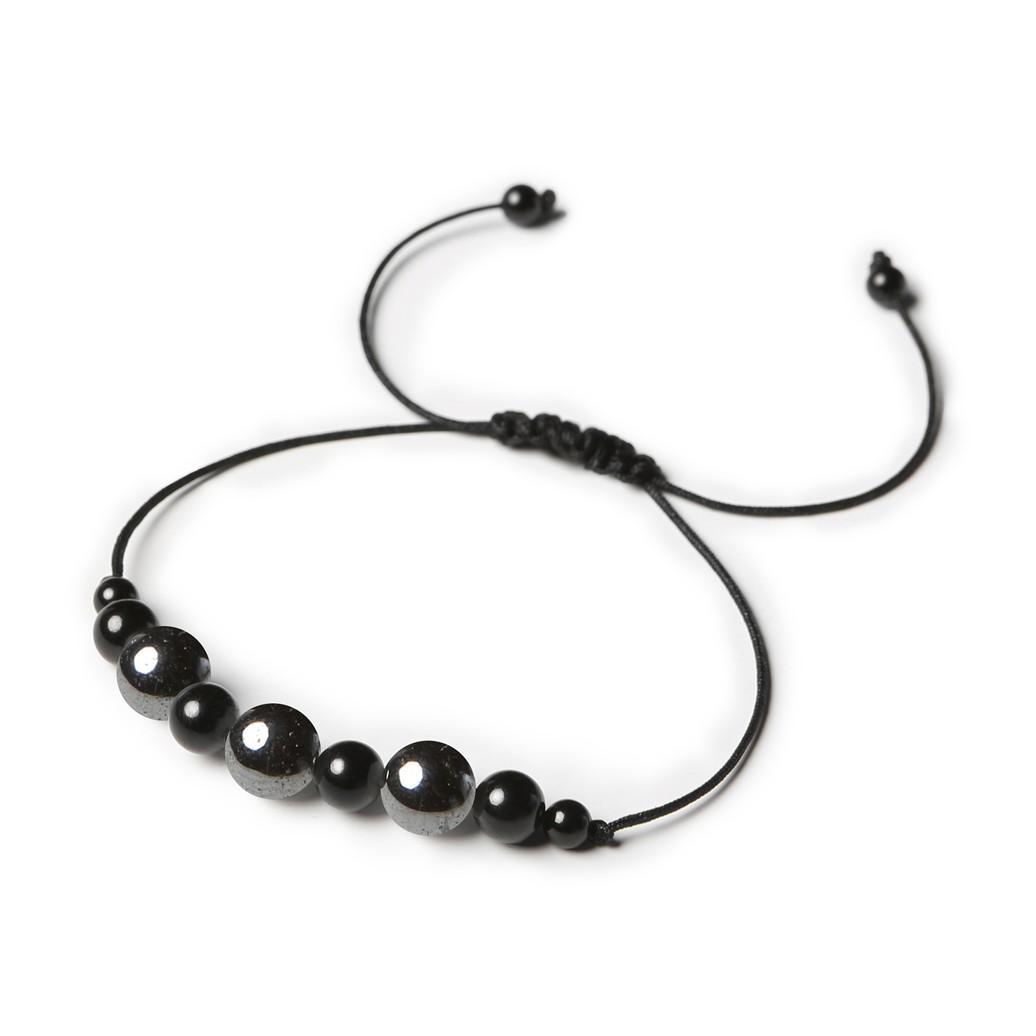 Stylowa bransoletka na sznurku Haka z hematytem grafitowym i turmalinem, dedykowana dla dam i panów Stylowa bransoletka Haka wykonana z naturalnych kamieni: hematytu grafitowego i turmalinu, dostępna dla wszystkich.