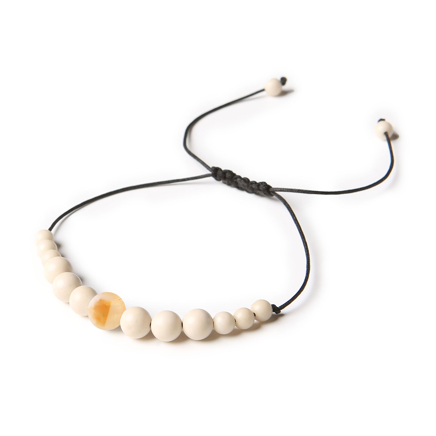 Stylowa bransoletka na sznurku z kamieniem rzecznym w kolorze cytrynowym, dostępna dla pań i panów z kolekcji Jaue Bransoletka Jaue z naturalnymi kamieniami - cieniowany cytryn i kamień rzeczny, dostępna w wersji damskiej i męskiej.