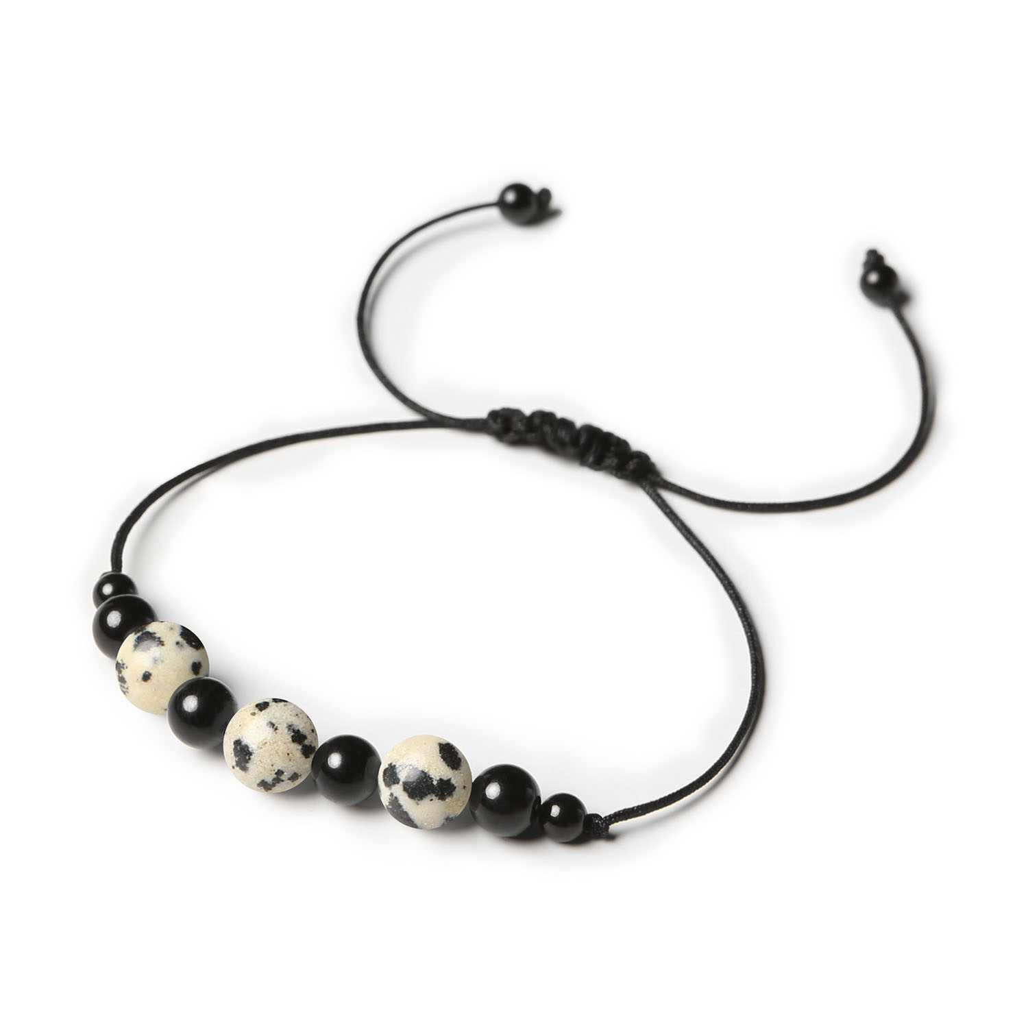 Kolekcja Haka Bransoletka na sznurku z Jaspisem Dalmatyńskim i Turmalinem dla wszystkich Stylowa bransoletka z kamieni naturalnych z serii Haka, z jaspisem dalmatyńskim i turmalinem, dedykowana zarówno kobietom, jak i mężczyznom.