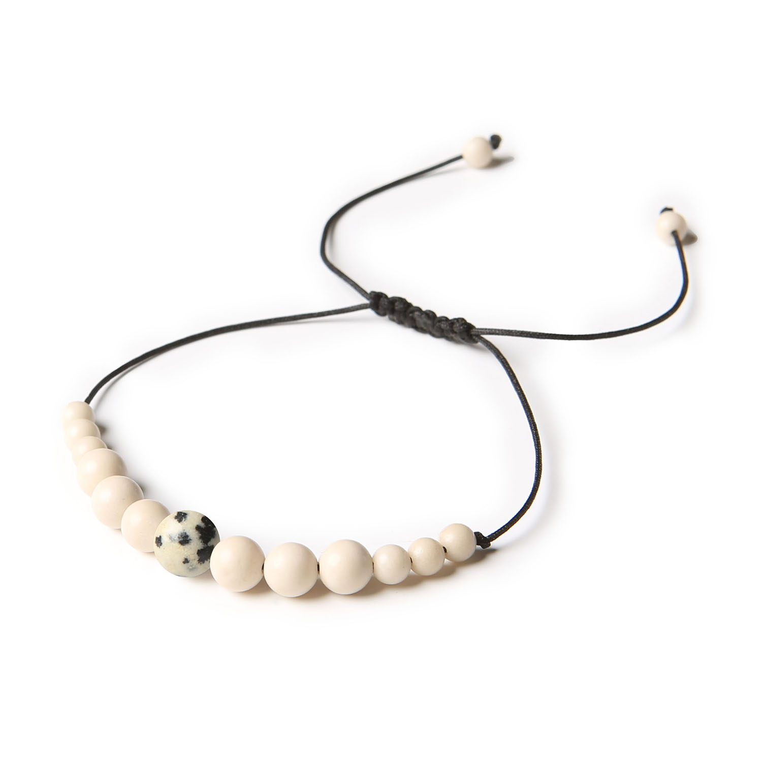 Stylowa bransoletka z Jaspisem Dalmatyńskim i Kamieniem Rzecznym - kolekcja Jaue dla niego i dla niej Bransoletka z kolekcji Jaue z naturalnymi kamieniami – jaspis dalmatyński i kamień rzeczny, idealna dla kobiet i mężczyzn.